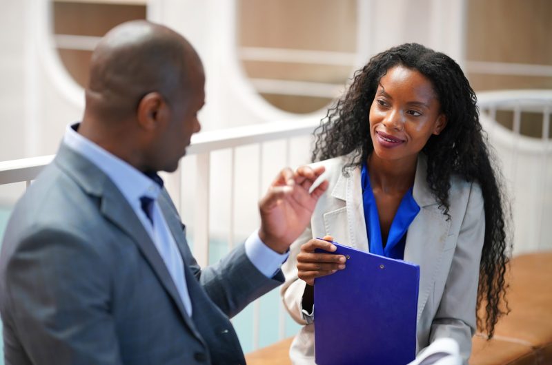 Business people in the workplace are discussing a working strategy for doing business Business people in the workplace are discussing a working strategy for doing business