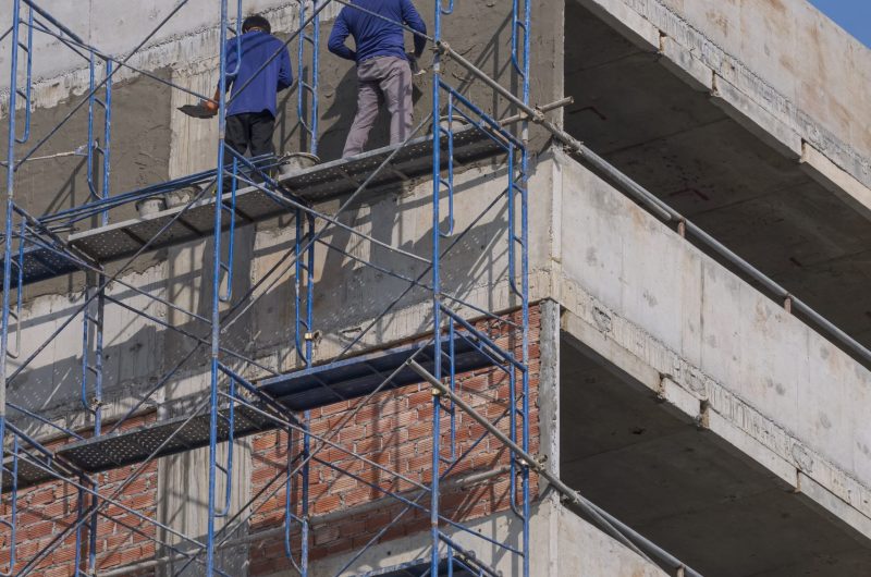 construction-workers-on-scaffolding-plastering-cem-2025-03-10-17-35-27-utc